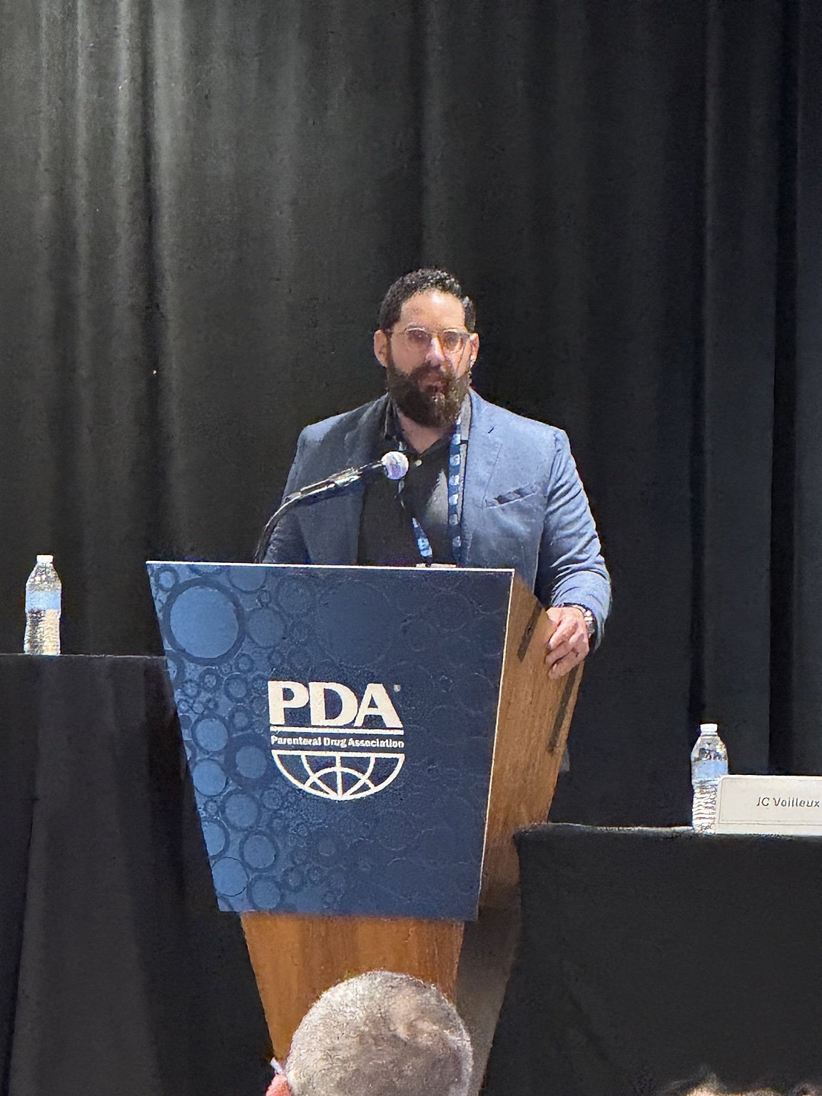 Subhi Saadeh speaking at a Parenteral Drug Association event