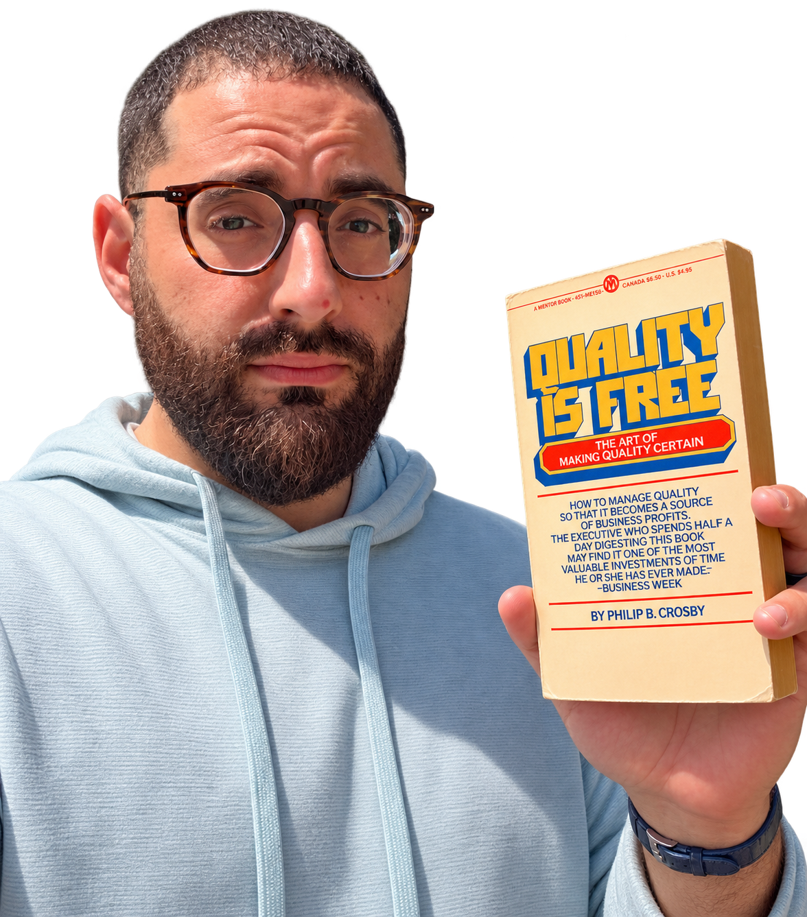 Subhi Saadeh holding Philip Crosby’s book Quality Is Free