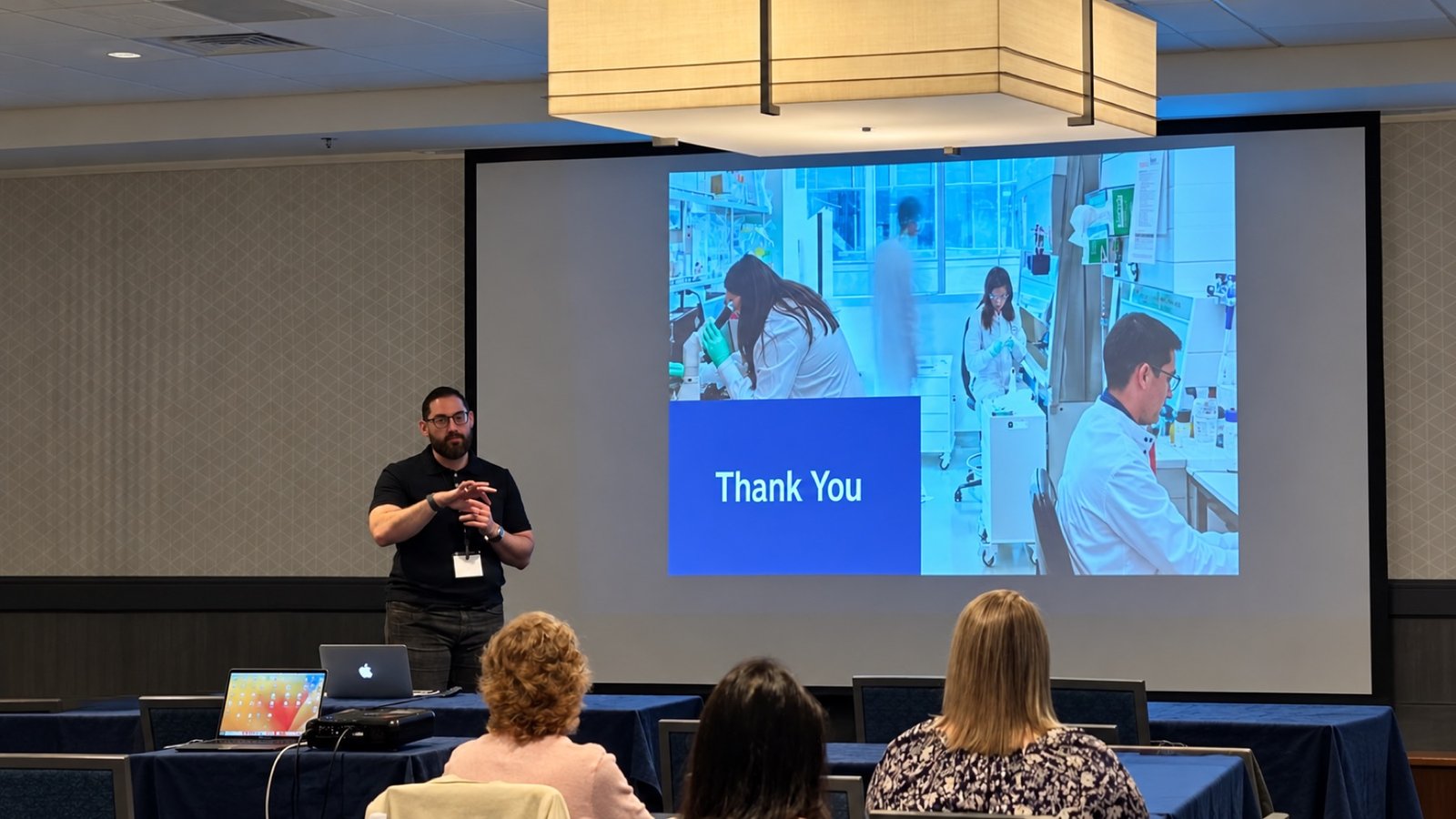 Subhi Saadeh leading a training session in front of an audience